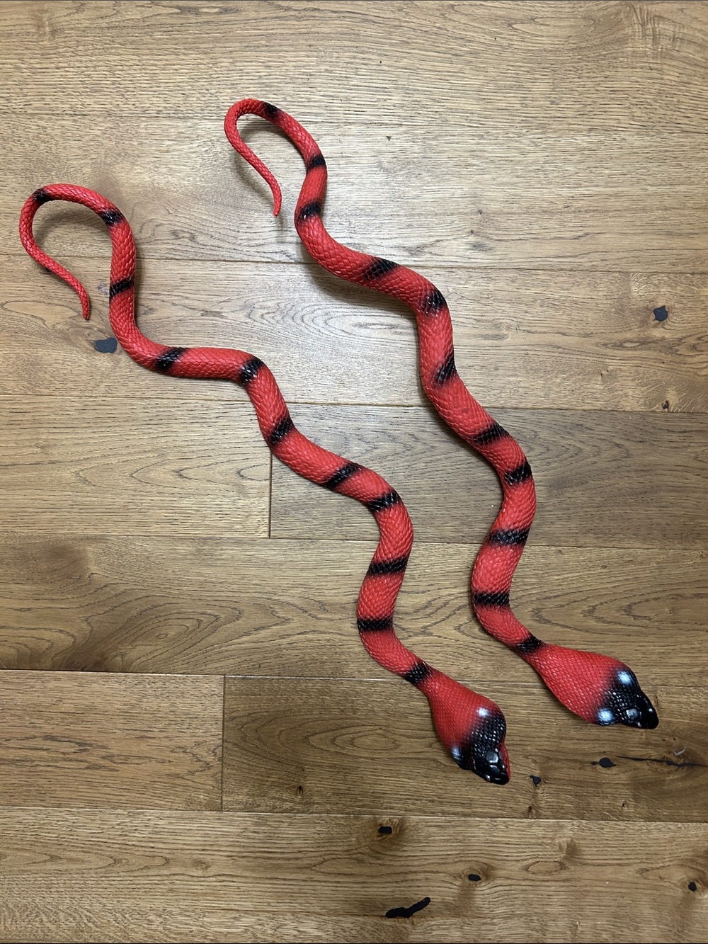 Red and Black Snake Plastic Pair - Realistic Decorative Snakes